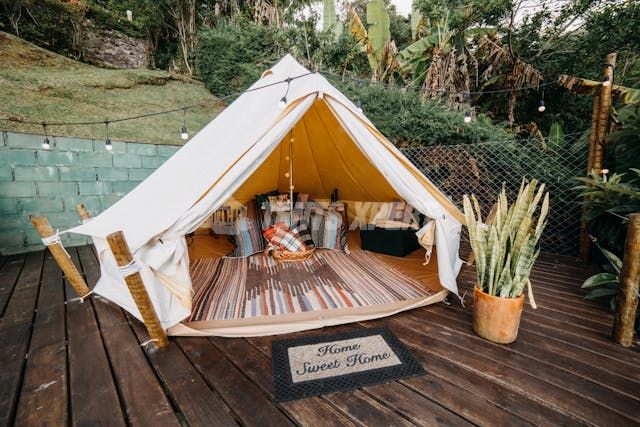 A tent placed on a wooden surface
